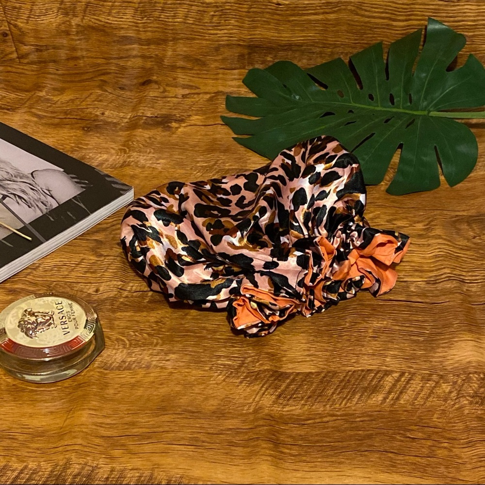 Silky Pink animal print hair bonnet with salmon coloured interior